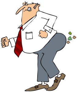 Business man farting from trapped gas and IBS