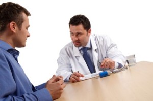 Doctor talking to a man about an IBS diagnosis.