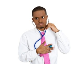 Man_with_tie_and_stethescopy_trying_self_diagnosis_self_diagnosis