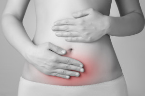 Picture of woman with lower abdominal pain shown in red.